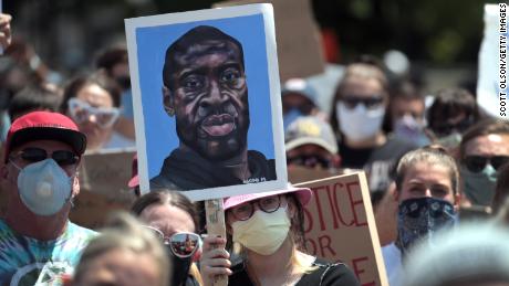 ST PAUL, MINNESOTA - MAY 31: Demonstrators protest outside of the state capital building as unrest continues in the city and around the country following the May 25, death of George Floyd on May 31, 2020 in St. Paul, Minnesota. The state called up 7,500 national guard troops to supplement state and local police, the largest domestic deployment of national guard in the state&#39;s history.   (Photo by Scott Olson/Getty Images)