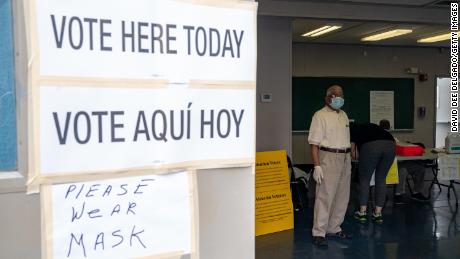 A poll worker at Liberty High School on July 7, 2020 in Jersey City, New Jersey. New Jersey residents will choose their candidates for president, Senate and House but because of the pandemic most are casting their votes by mail-in ballots. 