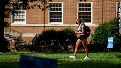 CHAPEL HILL, NC - AUGUST 18: A student walks through the campus of the University of North Carolina at Chapel Hill on August 18, 2020 in Chapel Hill, North Carolina. The school halted in-person classes and reverted back to online courses after a rise in the number of COVID-19 cases over the past week. (Photo by Melissa Sue Gerrits/Getty Images)