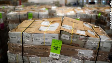 PORTLAND, OR - OCTOBER 14: Pallets filled with Washington and Oregon mail-in ballots fill an unloading area at a U.S. Postal Service (USPS) processing and distribution center on October 14, 2020 in Portland, Oregon. USPS workers in Portland began processing and mailing about 1.5 million ballots this week ahead of the November election.  (Photo by Nathan Howard/Getty Images)