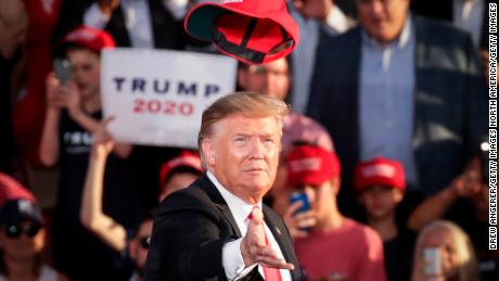 President Donald Trump tosses a hat into the crowd as he arrives for a &#39;Make America Great Again&#39; campaign rally at Williamsport Regional Airport, May 20, 2019 in Pennsylvania.