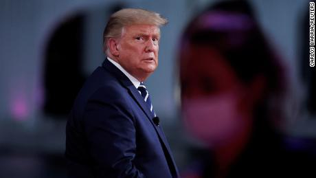 U.S. President Donald Trump looks on during a commercial break during a live one-hour NBC News town hall forum with a group of Florida voters in Miami, Florida, U.S., October 15, 2020. REUTERS/Carlos Barria