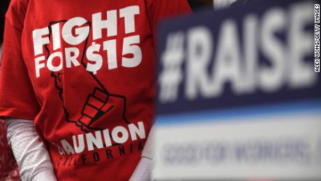 An activist wears a &quot;Fight For $15&quot; T-shirt during a news conference prior to a vote on the Raise the Wage Act July 18, 2019 at the U.S. Capitol in Washington, DC. The legislation would raise the federal minimum wage from $7.25 to $15 by 2025.  (Photo by Alex Wong/Getty Images)