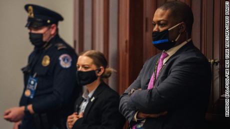 Capitol Police Officer Eugene Goodman and officers watch newly released video footage, of the January 6 attack, during the second day of Trumps second impeachment trial on February 10, 2021 in Washington, DC. - Democrats present the case against Donald Trump in his Senate impeachment trial Wednesday, arguing that he directed an enraged crowd to storm Congress in the dying days of his presidency -- even if Republicans look unlikely to convict. (Photo by BRANDON BELL / POOL / AFP) (Photo by BRANDON BELL/POOL/AFP via Getty Images)