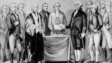 1788:  The inauguration of George Washington as the first President of the United States, also present are (from left) Alexander Hamilton, Robert R Livingston, Roger Sherman, Mr Otis, Vice President John Adams, Baron Von Steuben and General Henry Knox.  Original Artwork: Printed by Currier &amp; Ives.  (Photo by MPI/Getty Images)