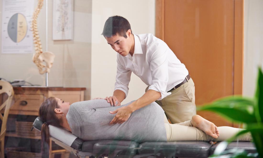 Chiropractor and patient