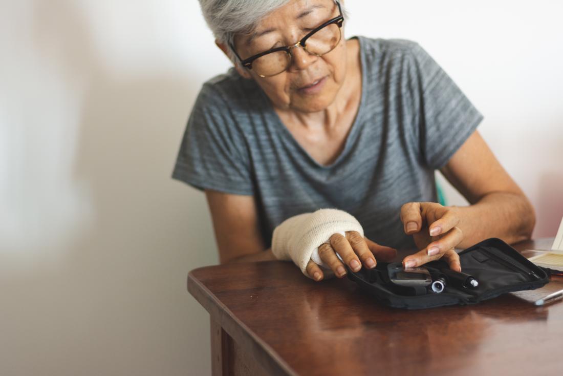 woman tests blood sugar