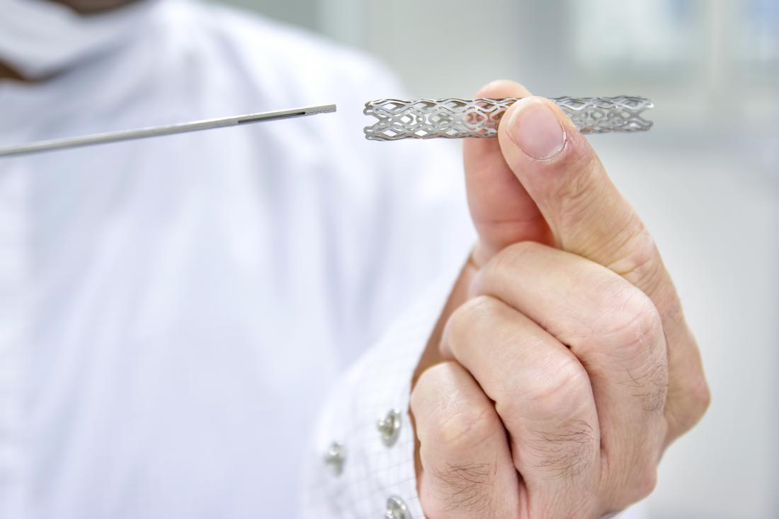 Doctor holding up heart stent