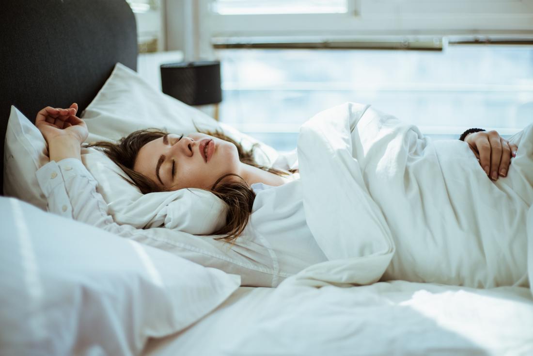 woman sleeping after using sleep aids