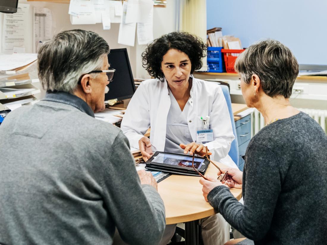 a doctor discussing Stevens-Johnson syndrome with two patients. 