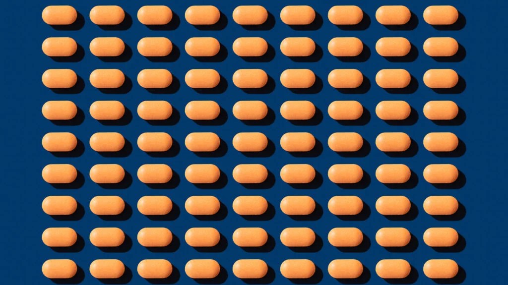 A graphic showing a repeating pattern of small, orange statin tablets