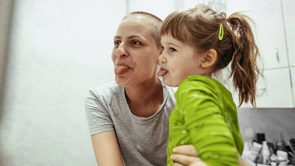 A woman with side effects from chemotherapy for breast cancer and her daughter