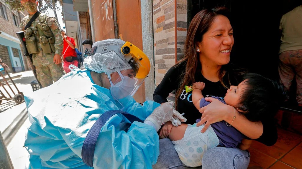 A person vaccinating a child against diphtheria.