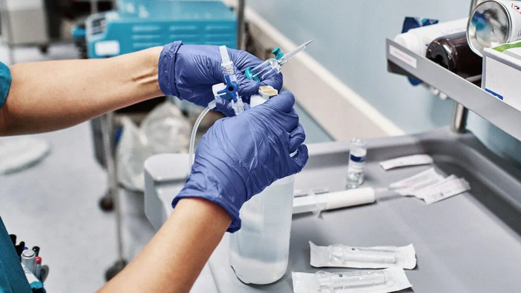 Closeup of a person preparing an infusion.