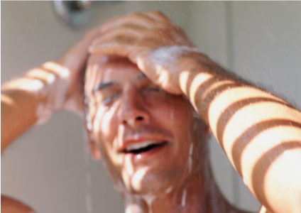 Man shampooing in shower