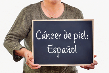 Woman holding a chalkboard in front of her chest