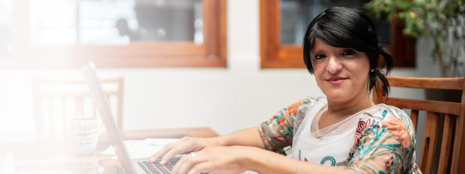 A woman using a laptop working from home