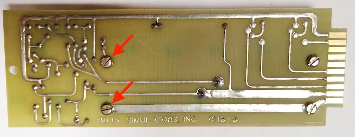 A regulator board was failing due to loose screws (red arrows). The circuit was powered through the thick bottom PCB trace and then
current passed through the heat sink from the lower screw to the upper screw.