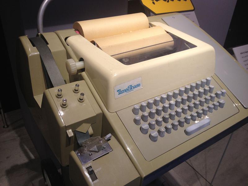 A Teletype ASR33 communicated in ASCII and printed 72 characters per line. Hundreds of thousands of these were produced from 1963 to 1981. The punched tape reader and punch is on the left. Photo from Arnold Reinhold, (CC BY-SA 3.0).