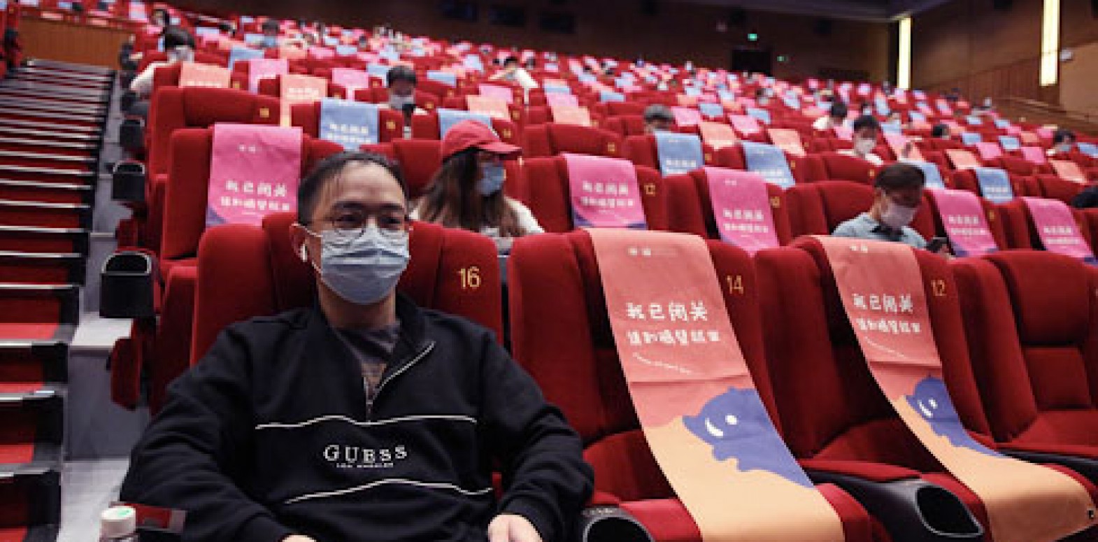 Has this Chinese man spoiled Valentine's Day for lovers by booking all two seats that next to each other at the cinema?