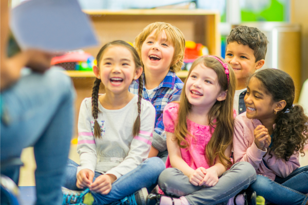 students listening to a book being read aloud