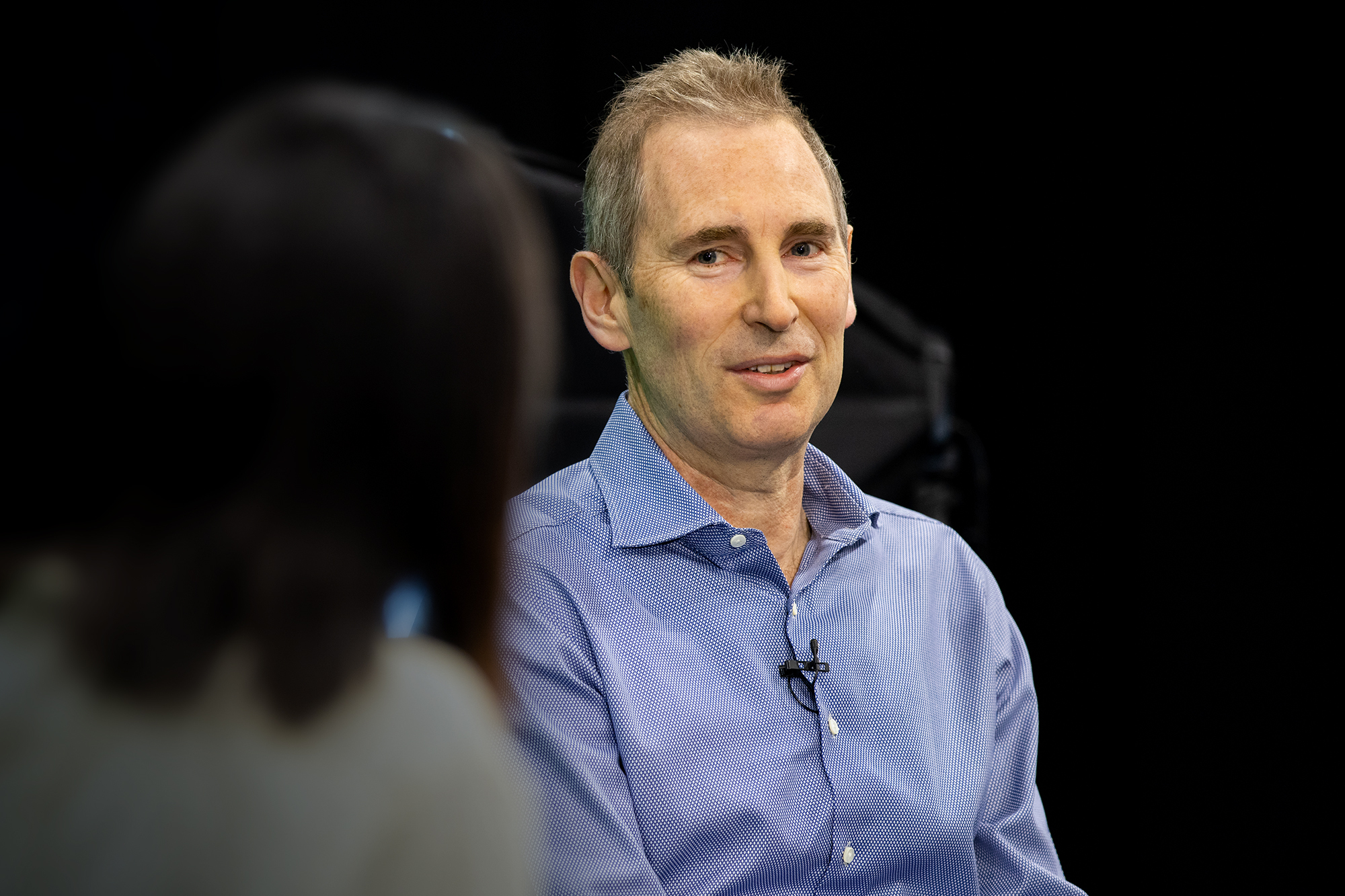 Andy Jassy, CEO of Amazon, speaks with Alicia Boler Davis as he answers employee questions at a fireside chat. 