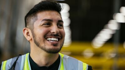 An image of Amazon employee Francisco Nino in a work vest at Amazon in Greenwood, Indiana.