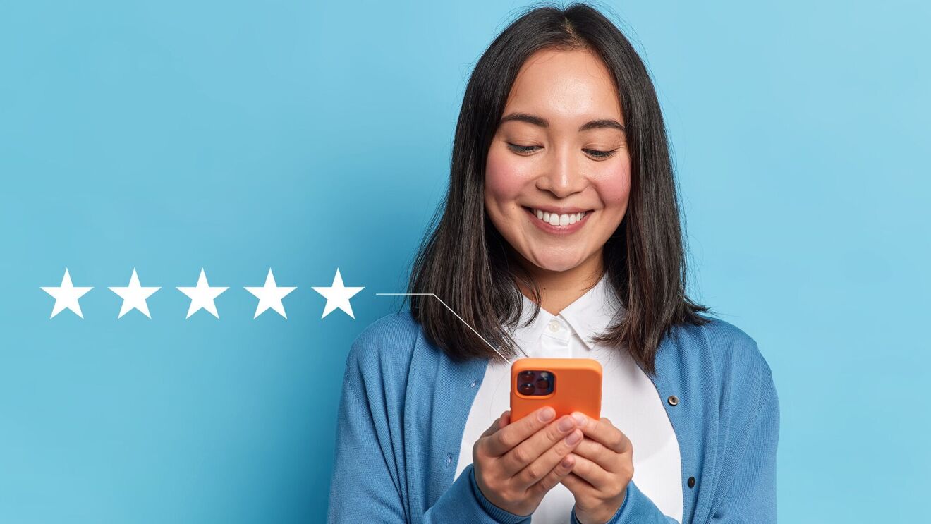 Five-star review concept with smiling woman holding orange smartphone
