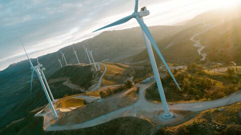 Renewable energy landscape with wind turbines and river