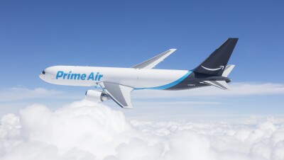 An Amazon Prime Air Boeing 767 flies above the clouds.