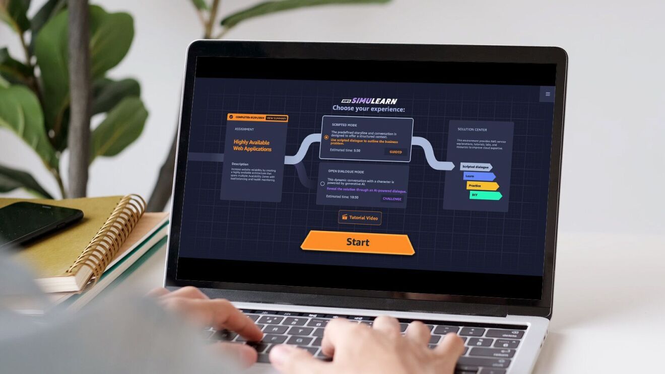 Hands typing on laptop keyboard displaying SimuLearn