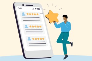 A graphic of a person holding up a star next to a life-sized smartphone with a reviews page pulled up.