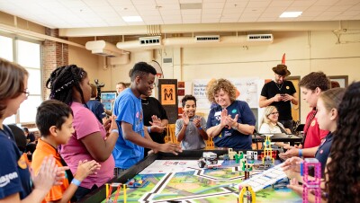 Students crowd around a STEM project at Metro Nashville Public Schools