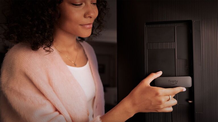 Woman using Fire TV streaming device