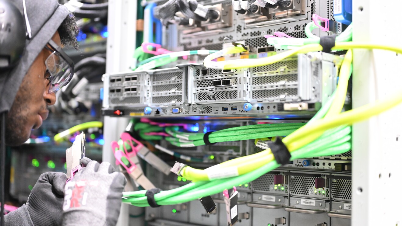 Engineer working on server racks