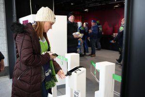 A customer inserts their credit card to enter District Market, a Just Walk Out technology store, in Lumen Field.