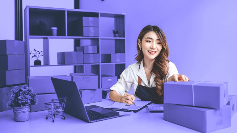 Business owners work on their laptops. 