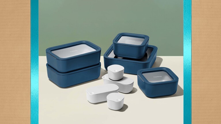 Set of navy blue plastic storage containers in various sizes, some open and some closed