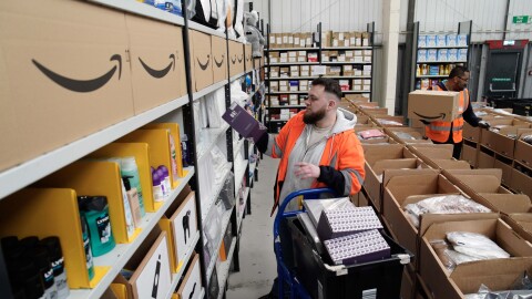 A man packs boxes at a Multibank