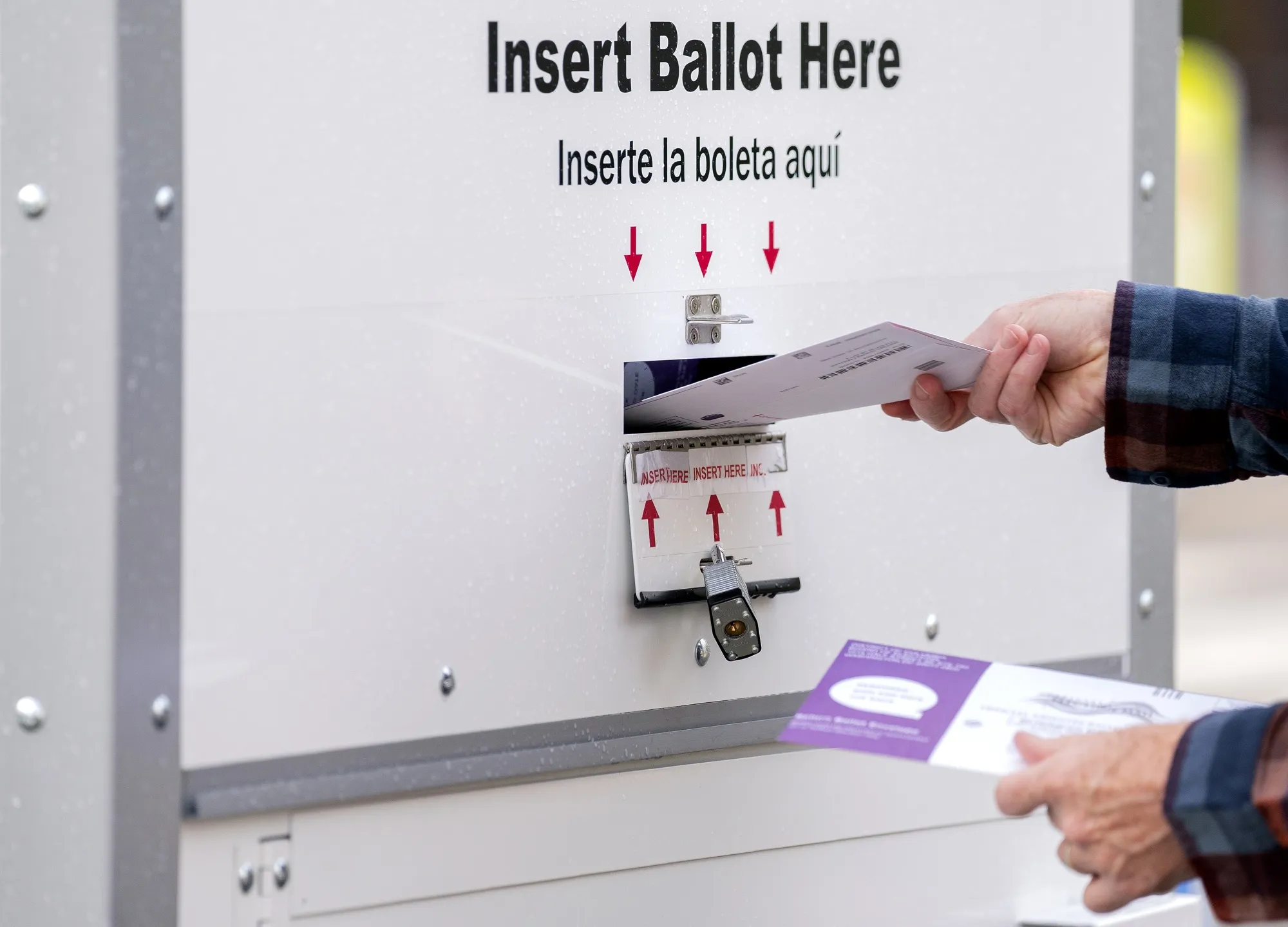 A voter deposits a ballot into an Official Ballot Drop Box in Washington, D.C.,&nbsp;on&nbsp;Oct. 30, 2020.&nbsp;