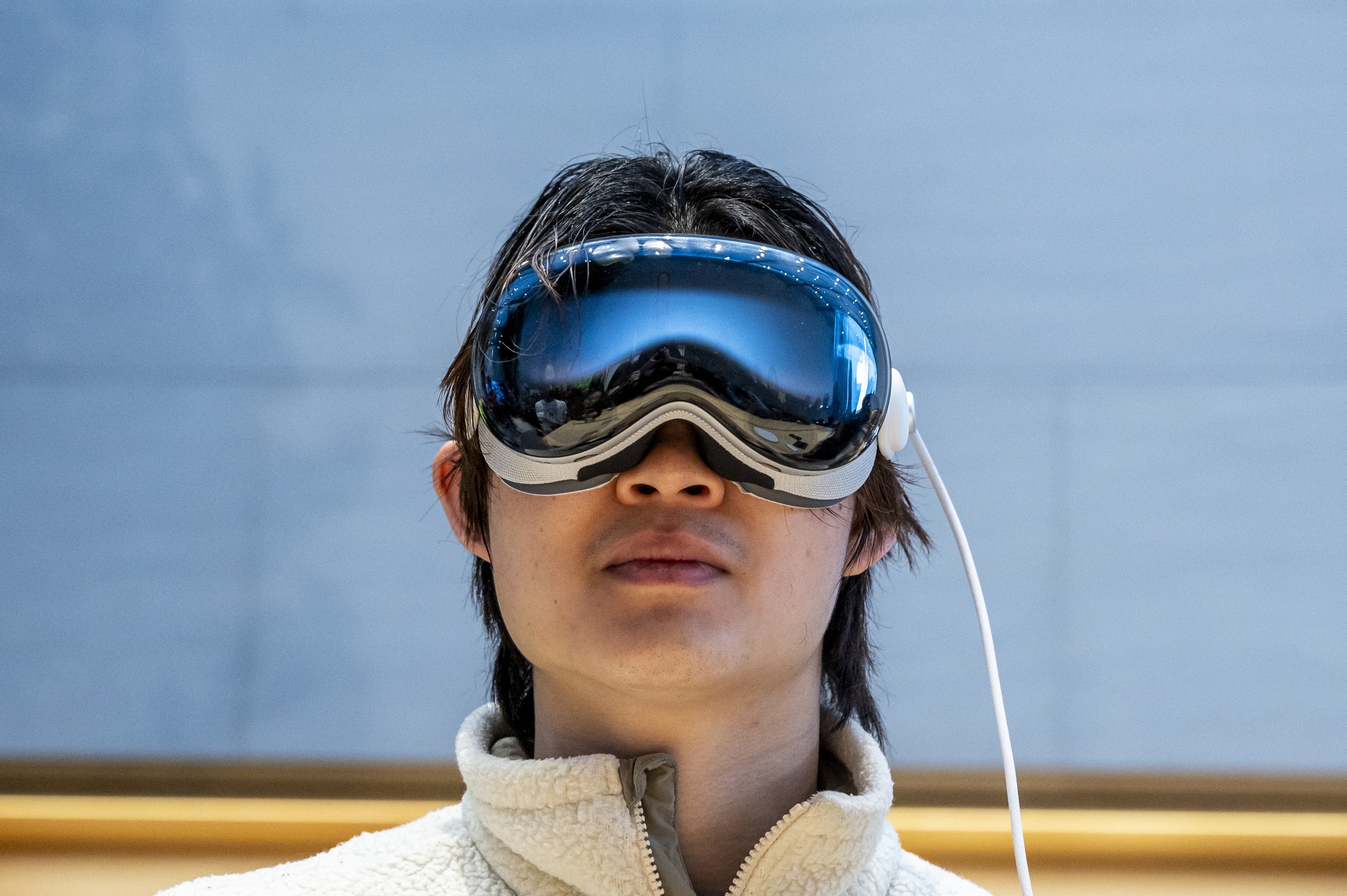 A customer with an Apple Vision Pro&nbsp;at the company’s store in Palo Alto, California.