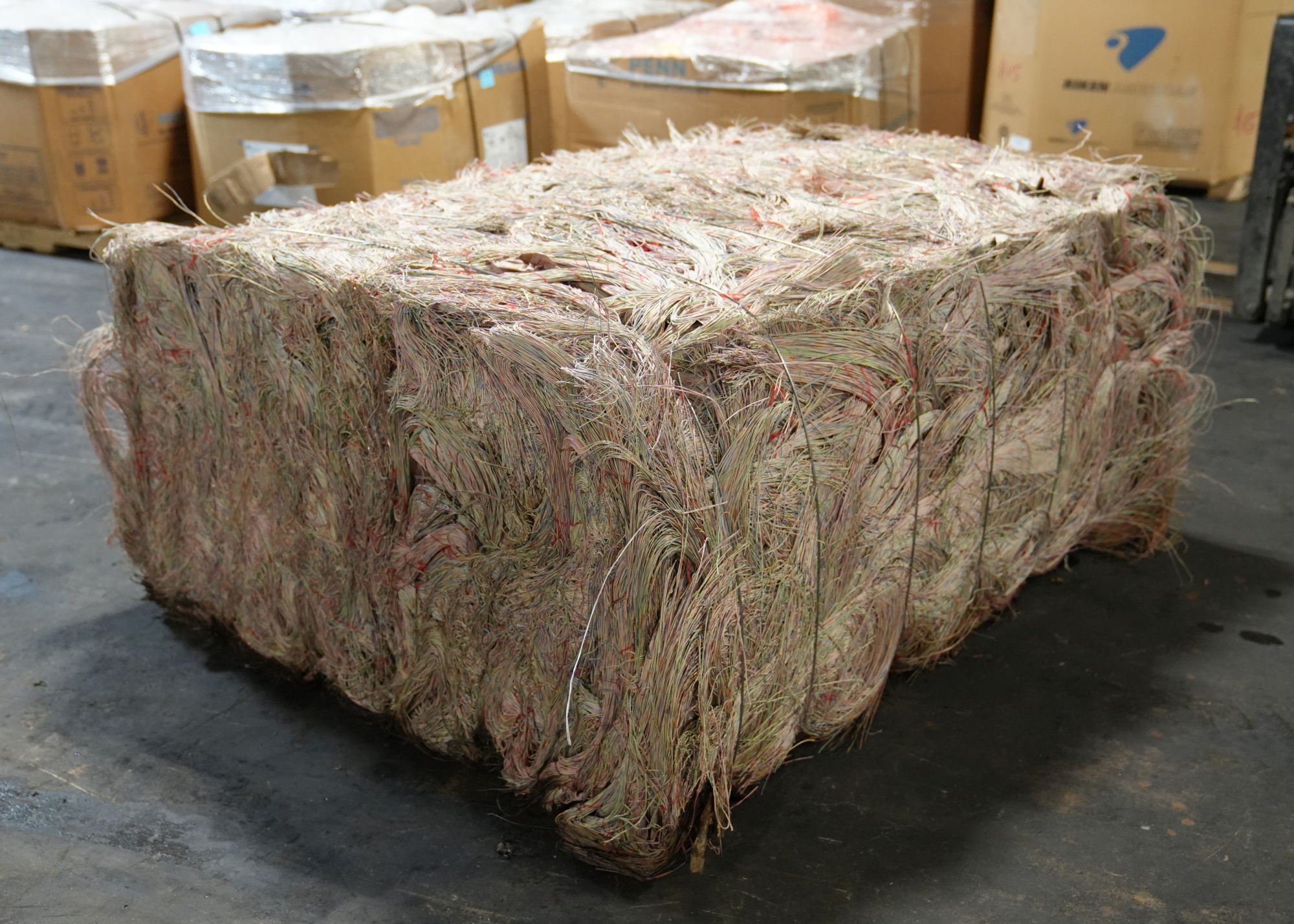 Bale of paper-covered wires from copper cables in a recycling facility in Dallas, Texas, in April 2024.
