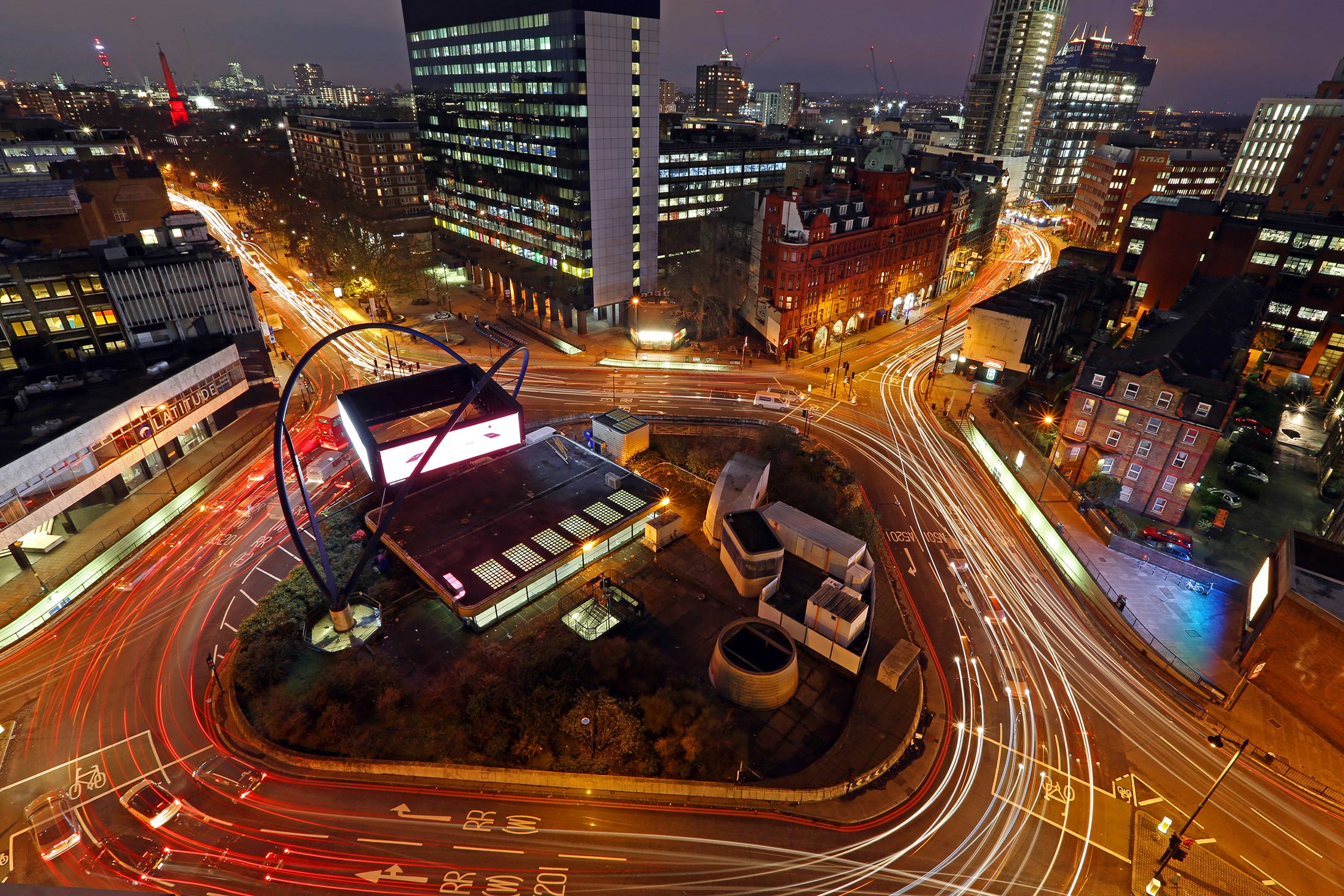 Light trails from traffic are seen at the Old Street roundabout in the area known as London’s Tech City on Dec. 17, 2013. 
