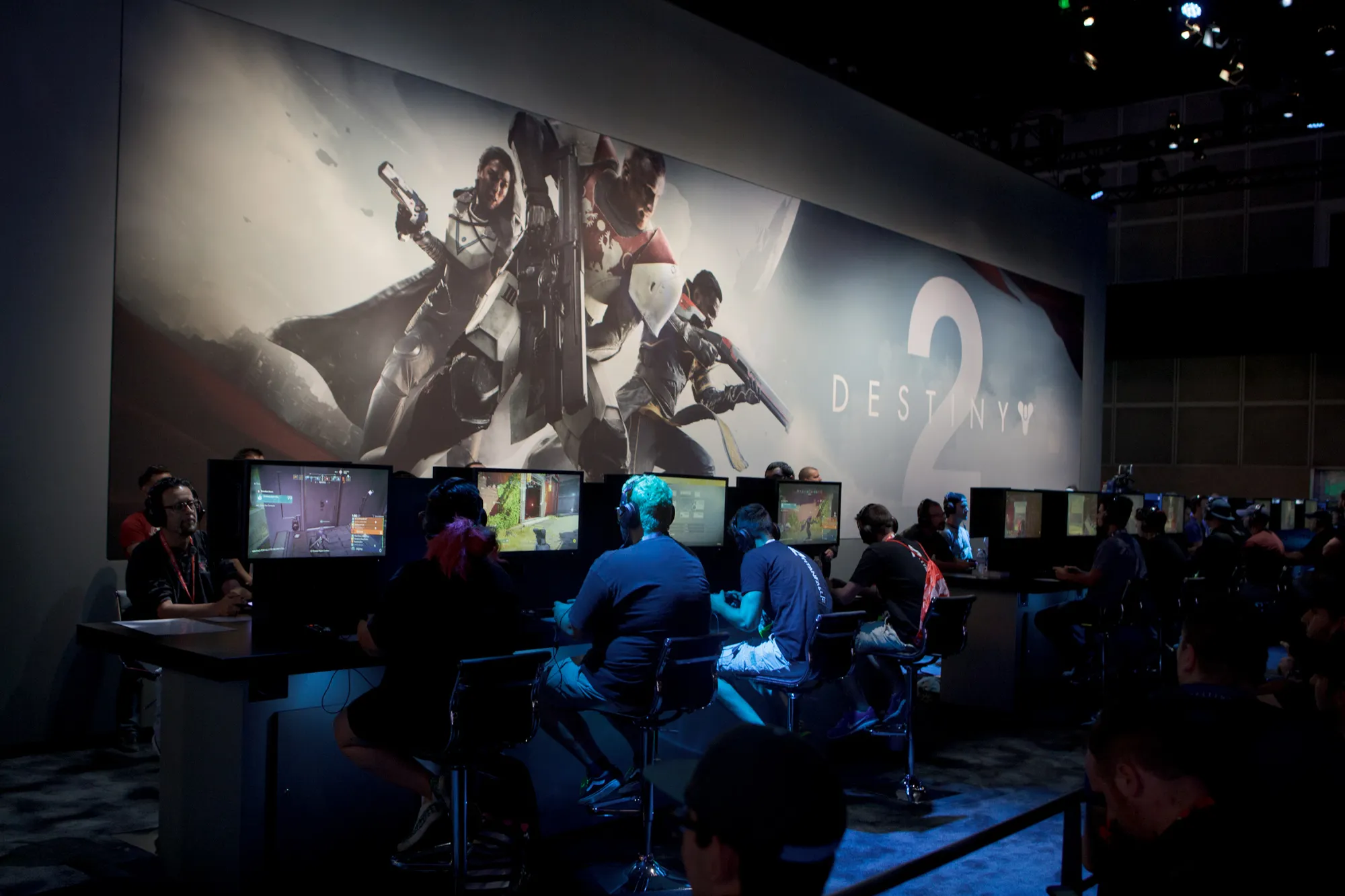 Attendees play the &quot;Destiny 2&quot; video game developed by Bungie Inc. and published by Activision Blizzard Inc. during the E3 Electronic Entertainment Expo in Los Angeles, California, U.S., on Tuesday, June 13, 2017. For three days, leading-edge companies, groundbreaking new technologies and never-before-seen products is showcased at E3.