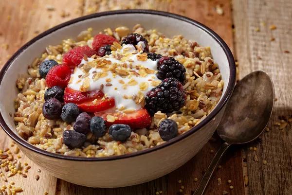 Bowl of whole-grain oatmeal with berries on top