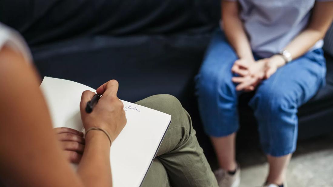 Person talking with therapist in a private setting