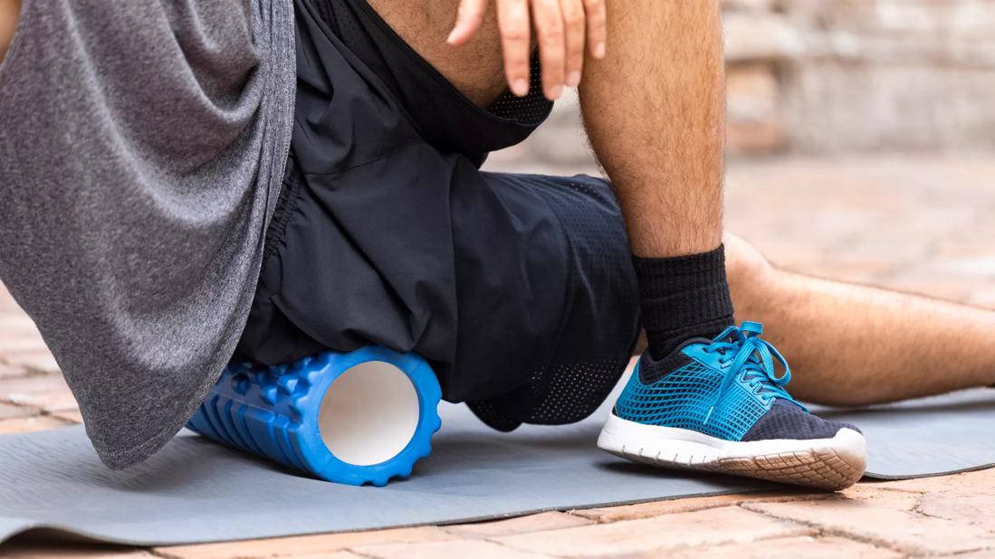 Person stretching on foam roller