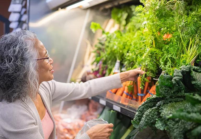 Senior ethnic woman grocery shopping