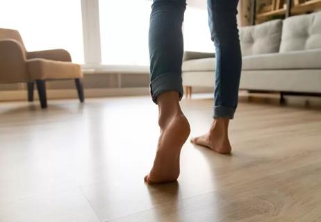 Person in home has a clear pathway to the sofa and chair without tripping.