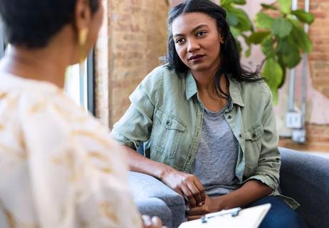 Person talking to healthcare provider to gain insight and tools to help with people pleasing behavior.